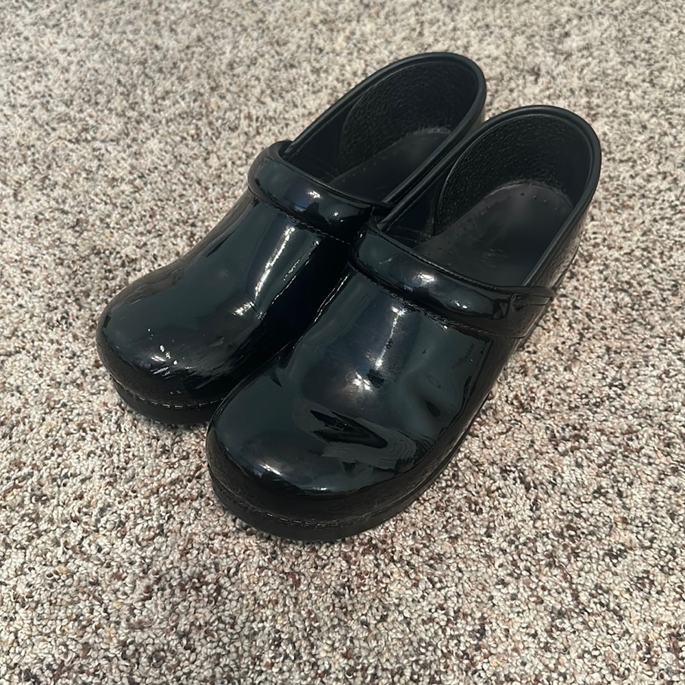 Dansko patent leather clogs